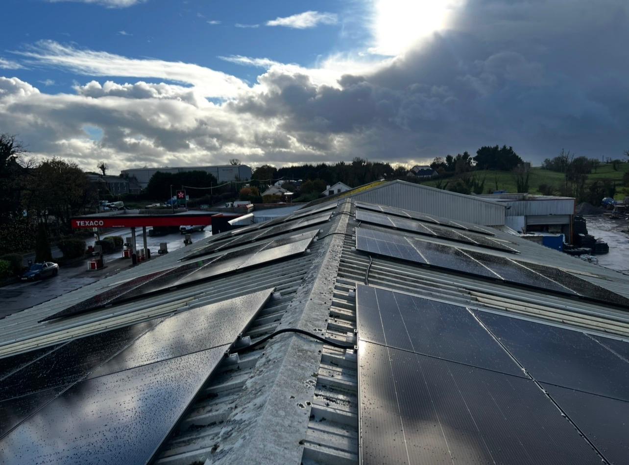 Commercial solar panel array on a warehouse rooftop in Roscommon
