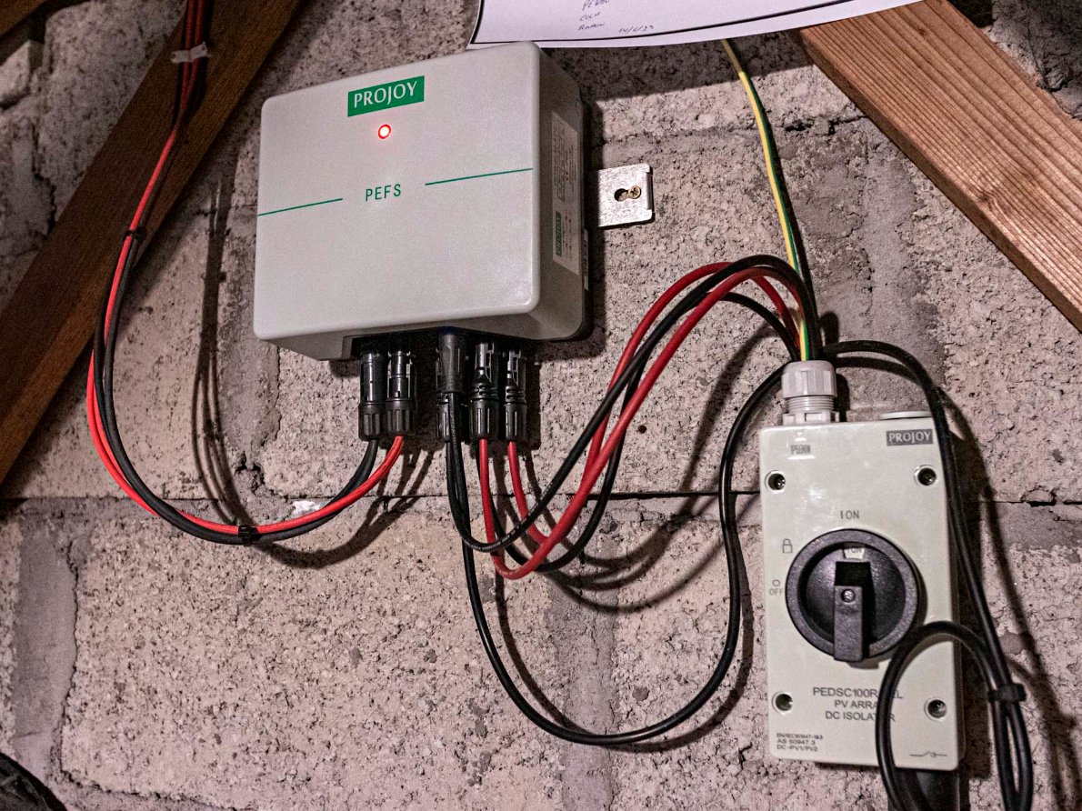 Certified solar technician inspecting panels during maintenance check